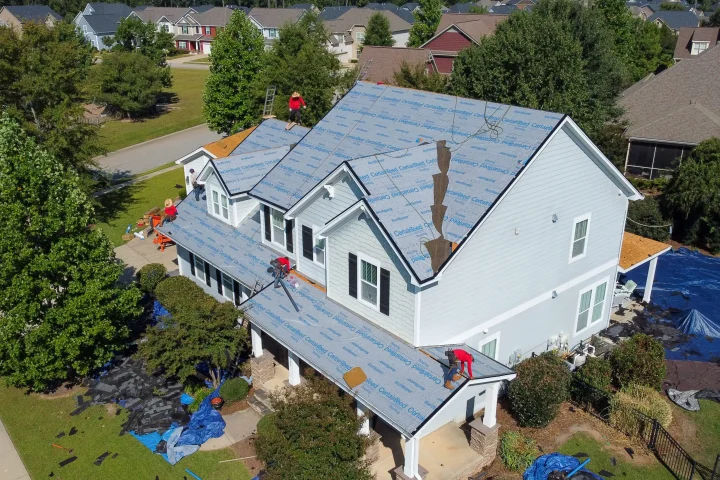 Our commercial roofing contractors installing a durable and energy-efficient TPO flat roof for a local business in Macon, Georgia.