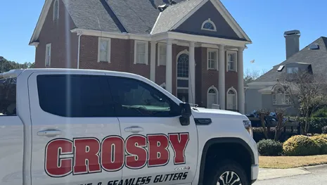 Improving curb appeal and weather resistance with brand new vinyl siding installed by Crosby Roofing and Seamless Gutters in Macon.